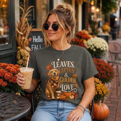 Woman sitting at an outdoor cafe table with iced coffee and sunglasses, wearing pepper 'Leaves Lattes & Golden Love' t-shirt