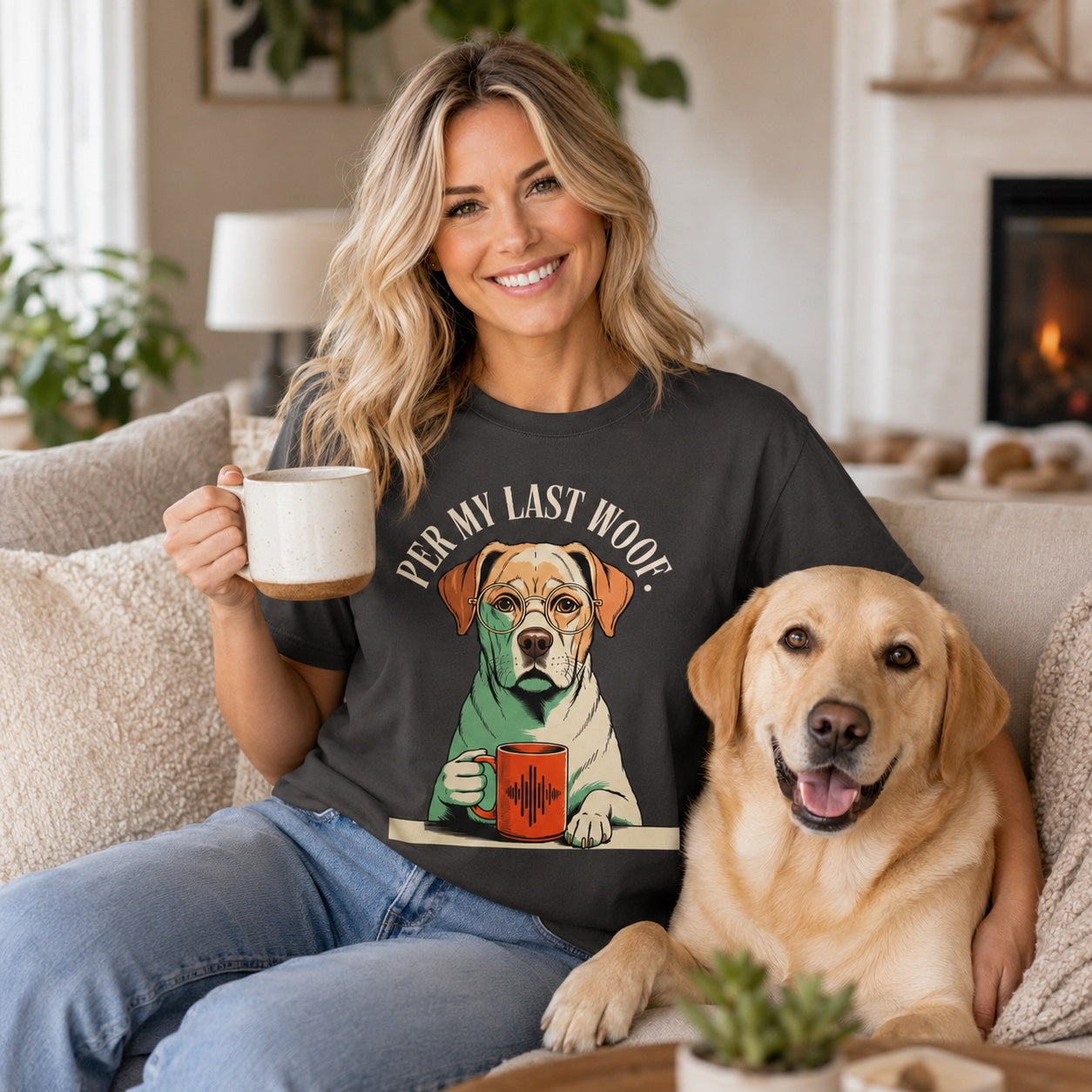 Woman sitting on a couch with a mug and her Labrador, wearing graphite 'Per My Last Woof' t-shirt