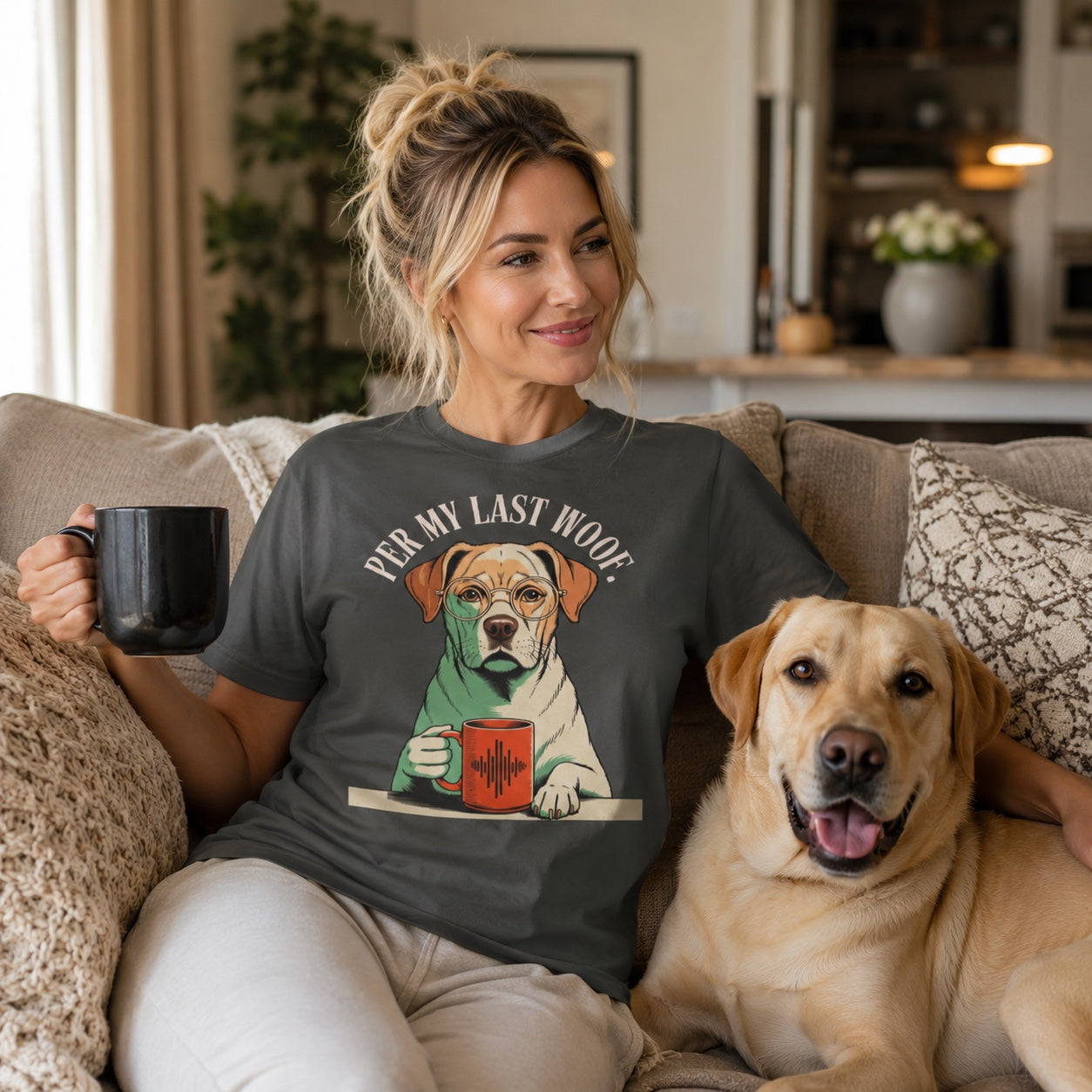 Woman sitting on a couch with a mug and her Labrador, wearing pepper 'Per My Last Woof' t-shirt