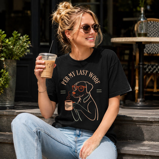 Woman wearing black 'Per My Last Woof' Labrador coffee t-shirt holding iced coffee on cafe steps