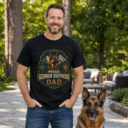 Man wearing a black Proud German Shepherd Dad T-shirt on a patio with a German Shepherd dog.
