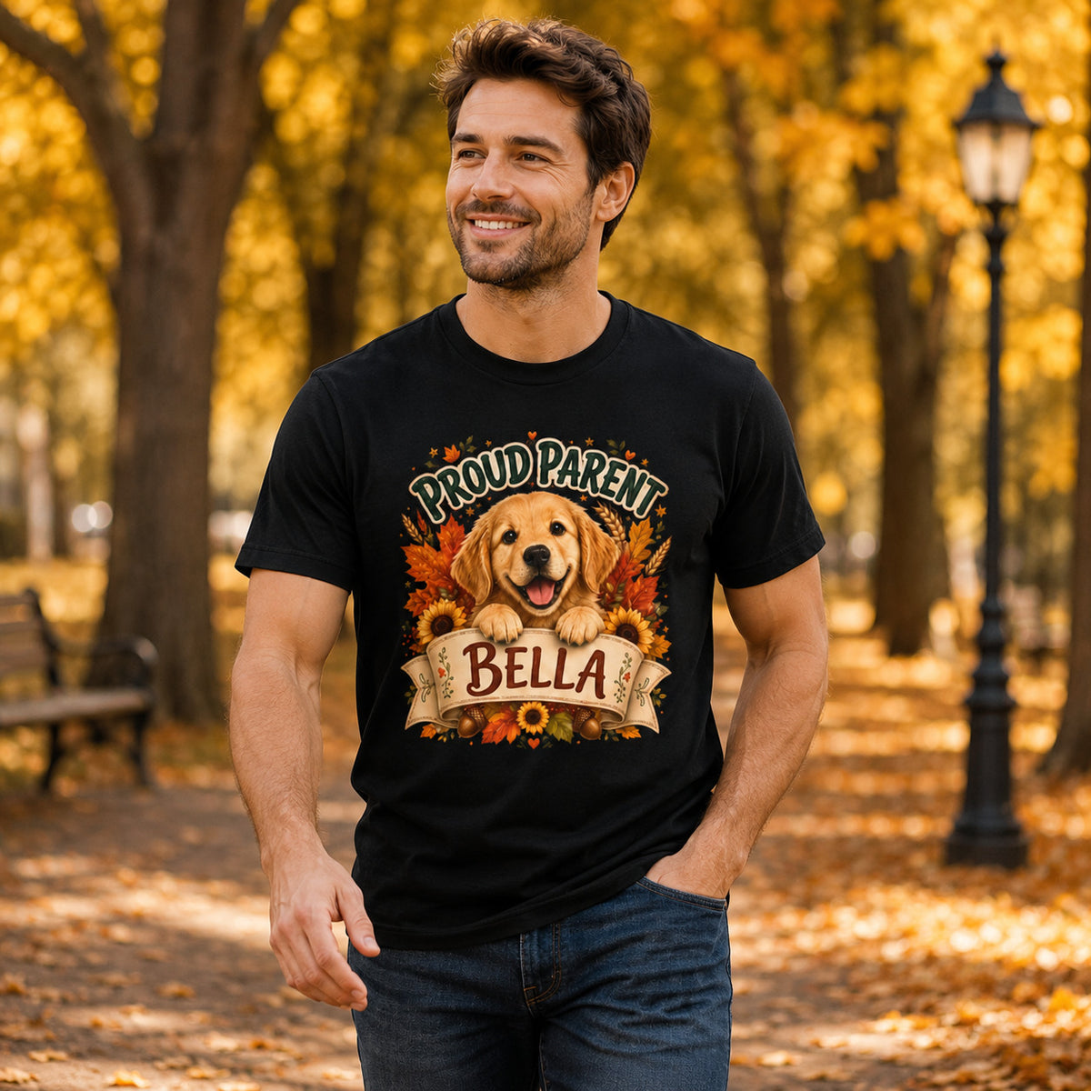 Model wearing a black Proud Parent Bella t-shirt with a Golden Retriever in a lifestyle scene