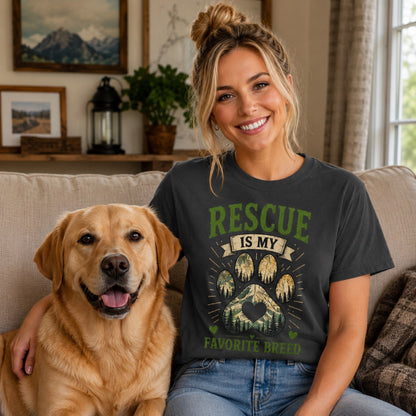 Woman wearing a graphite Rescue Is My Favorite Breed T-shirt on a sofa with a labrador.