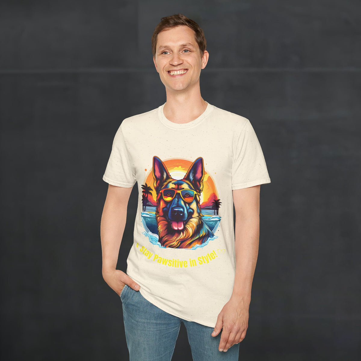 Male model wearing natural color German Shepherd “Stay Pawsitive in Style” T-shirt with colorful retro sunset beach dog graphic.