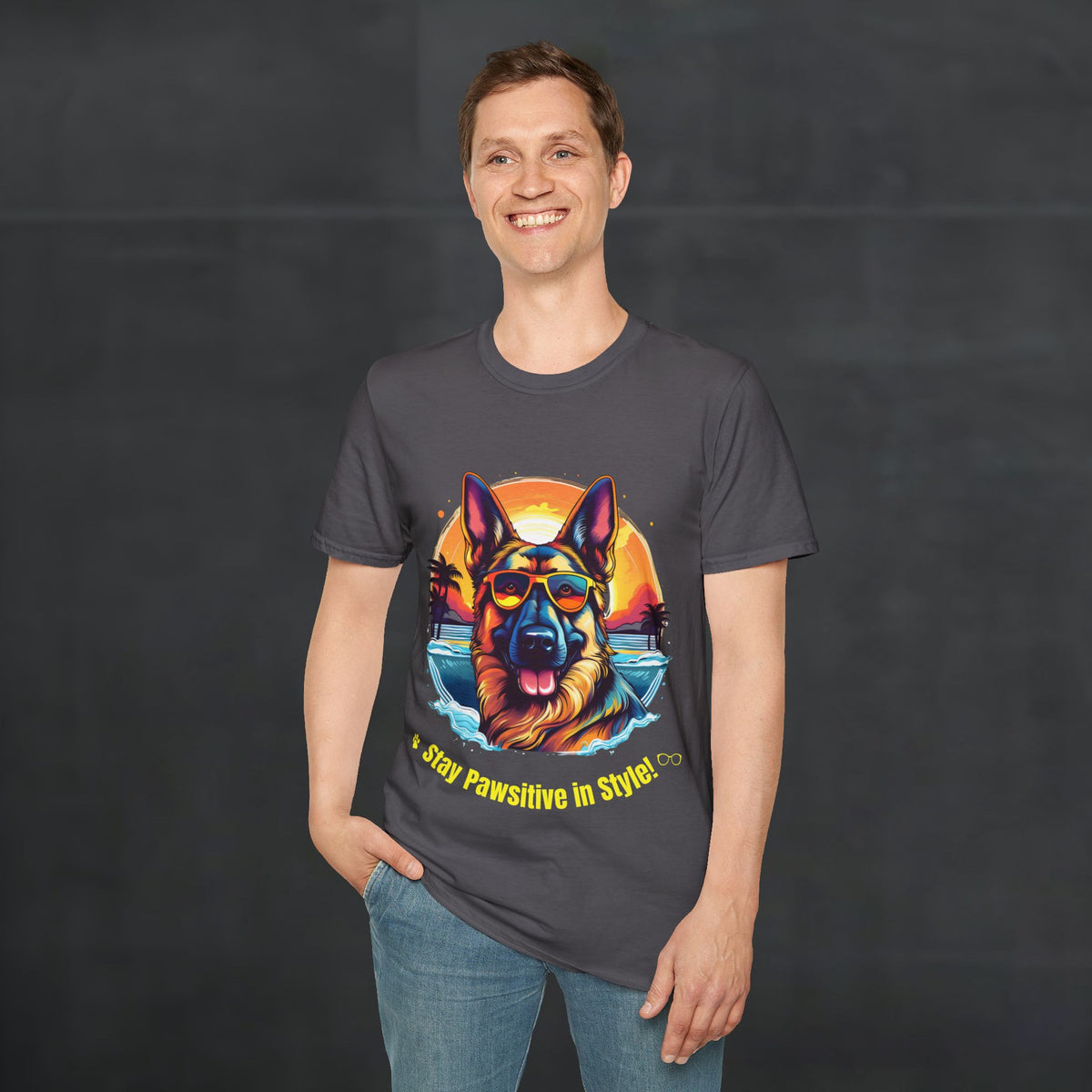 Man wearing a charcoal color Stay Pawsitive German Shepherd t-shirt with a German Shepherd graphic in a street lifestyle scene
