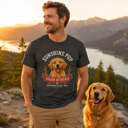 Man standing lakeside in front of mountains with his golden retriever, wearing graphite 'Sunshine Pup Golden Retriever' t-shirt