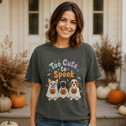 Woman wearing the Pepper Too Cute to Spook dog Halloween T-shirt on an autumn porch with pumpkins.